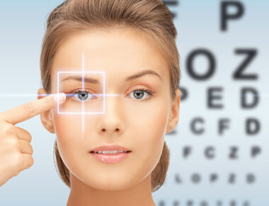 34710495 - medicine, eyesight control, laser correction, people and health concept - beautiful young woman pointing finger to her eye and over blue background with eye chart